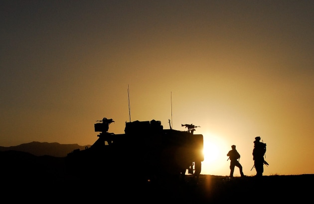 Australian soldiers are silhouetted against an Afghan sunrise as they prepare for another day's mission during Operation Zamarai Lor in 2009. (Defence)