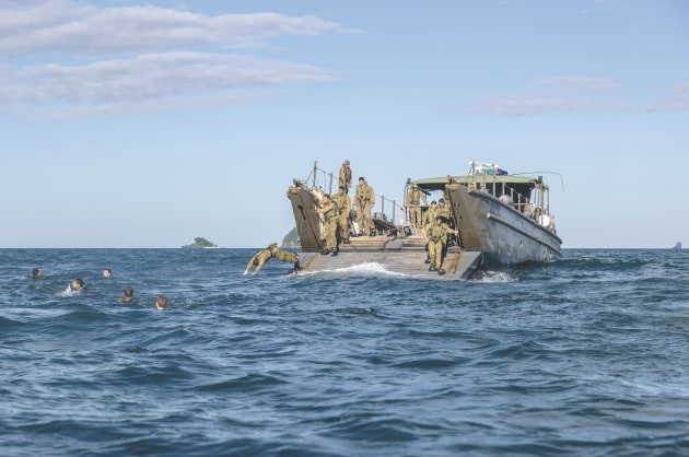 Soldiers from 2RAR swim to shore from an Army LCM-8 Landing Craft at Cowley Beach during Exercise Sea Explorer. (Defence)