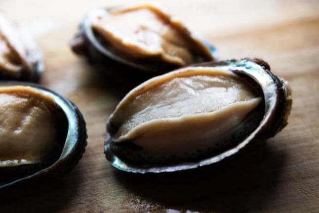 Researchers have traced the origin of Australian abalone through their shell composition, a discovery that could significantly reduce the illegal trafficking of high-value seafood.
Source: Getty Images