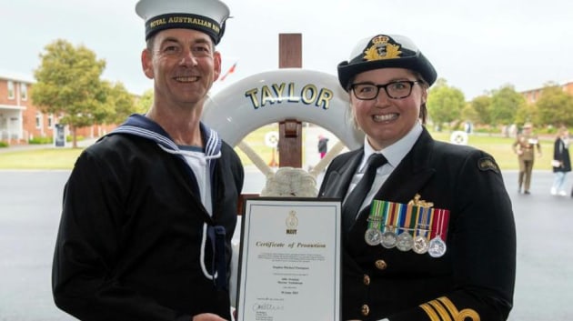 Commanding Officer Royal Australian Navy Recruit School, Commander Alisha Withers, right, promotes Seaman Stephen Thompson to the rank of Able Seaman, after the General Entry 413 Taylor Division graduation ceremony at HMAS Cerberus, Victoria. Credit: Leading Seaman James McDougall
