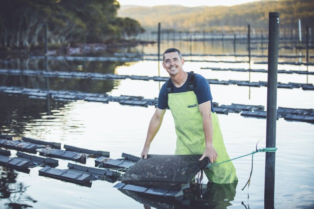 A 'doing' portrait of an oyster farmer. Image: &copy; Tim Levy