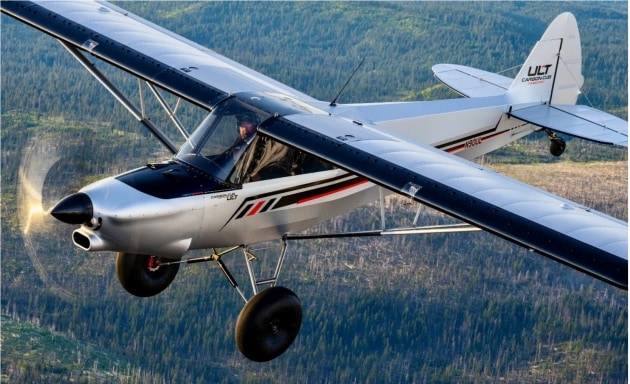 CubCrafters Vice President Brad Damm flies the new Carbon Cub ULT over the pine-covered foothills of Washington's Cascade Mountains during flight testing near the company's headquarters in Yakima, WA. (Cubcrafters)
