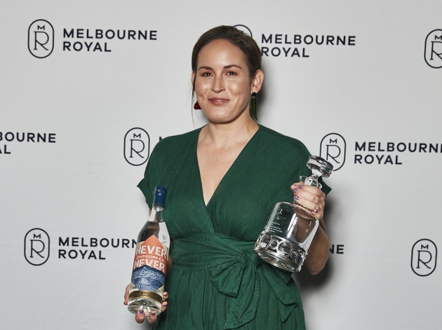 Never Never Distilling Co. brand ambassador Shae Chamberlain accepting the distillery's awards at the Australian Distilled Spirits Awards. (Source: Melbourne Royal)