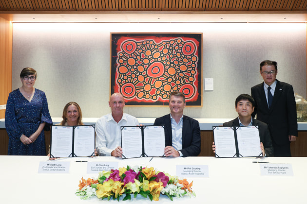 Deal done: L-R: Dr Angela Macdonald PSM, Australian Ambassador, Kath and Tom Long, Phil Cocking, Takanobu Sugiyama and Kazuhiro Horiba.