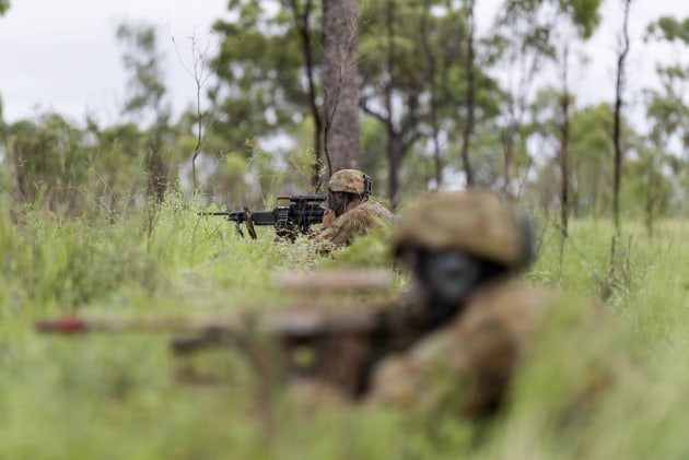 Australian Army officer trainees conduct a patrol during the Royal Military College training activity near Townsville, Queensland.
Defence