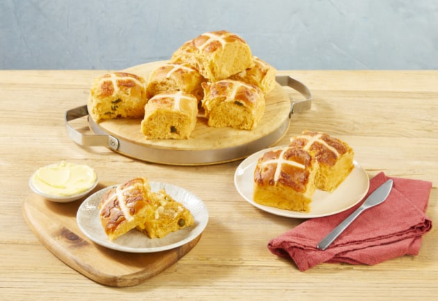 Coles savoury hot cross bun made with the supermarkets Special Burger Sauce. Image: Coles