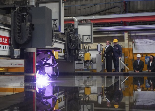 Minister for Defence Procurement Anne-Marie Trevelyan set the plasma cutting machine to work on a plate of steel. Credit: BAE Systems