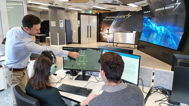 STELaRLab scientists pictured testing decision support AI systems using a live, virtual, constructive training system. (Supplied)