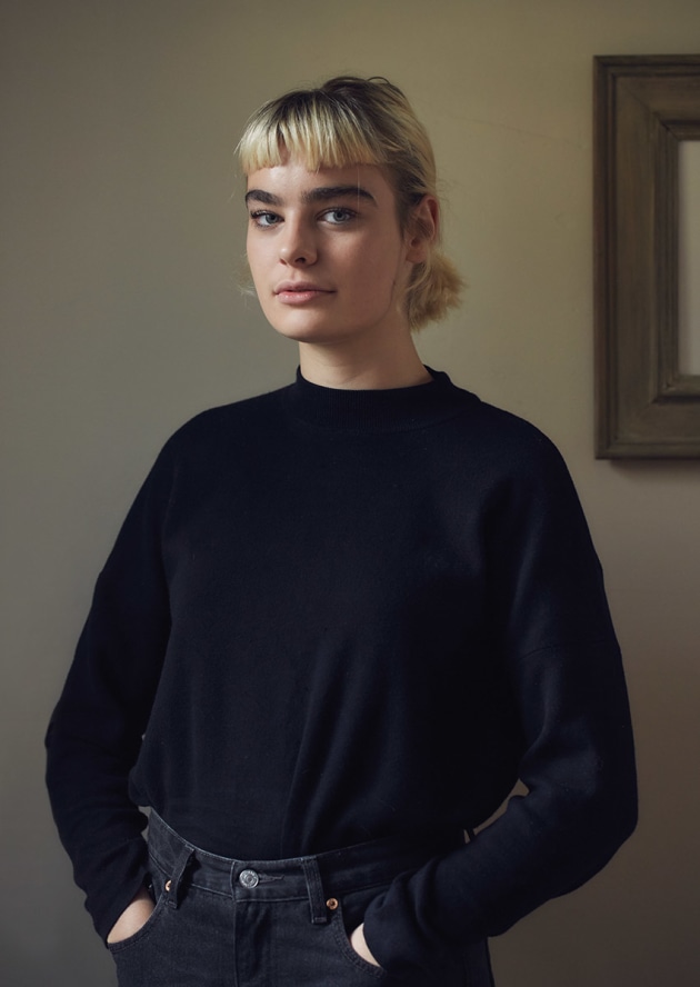 Stella #1, 2017 by Michele Aboud. Stella has the presence of a bygone era. Her naturally enigmatic expression entices the viewer to remain a second longer &ndash; we feel that she is very comfortable in front of the lens. The setting is formal, not by design, but simply by working with what the environment provided. The muted colour palette enhances this formality.