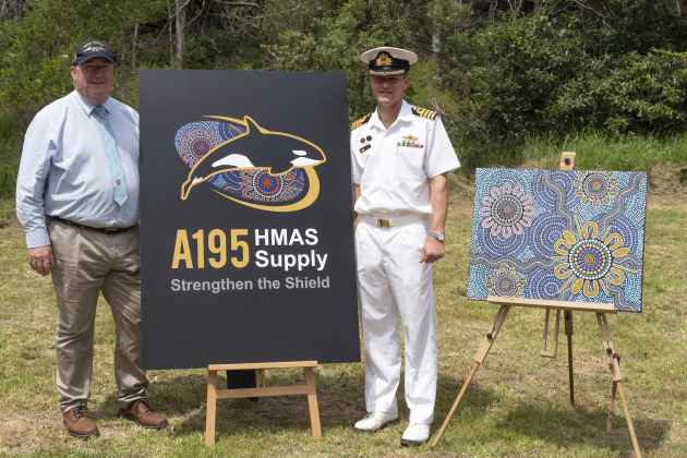 Bega Valley Shire Council Mayor Russell Fitzpatrick and NUSHIP Supply Commanding Officer Captain Ben Hissink stand next to the new mascot.
Defence