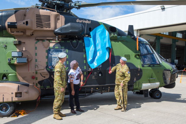 LTCOL Kim Gilfillan, WO1 Terry Hangan (right), and Wulgurukaba representative Brenton Creed unveil MRH 90 Gurindal, the Wulgurukaba word for 'vigilance'.
Defence