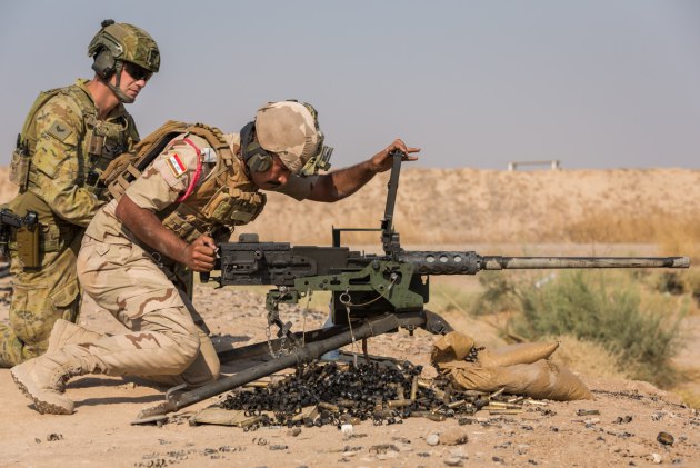 A member of Task Group Taji 9 observes an Iraqi Army soldier clearing a 12.7mm Browning machine gun during a live-fire training exercise at the Besmayah training area.
Defence