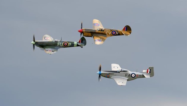 Three iconic WWII fighters in formation: Spitfire, P-40 Kittyhawk and CA-18 Mustang. (Steve Hitchen)