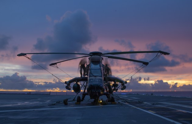 A Tiger ARH has work conducted on it at night during the Regional Presence Deployment 2020.
Defence