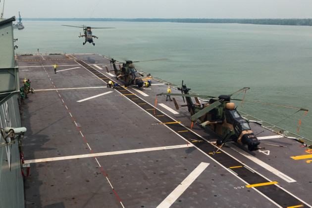 The Tiger helicopters land on HMAS Canberra&rsquo;s flight deck.
Defence