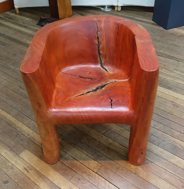 Tim Wilson, Animal Chair, rose gum. "I worked with a chainsaw artist to produce this modern design of a reading chair carved from a solid stump. The concept stems from my exploration of animalistic forms with a range of hand made ceramics, where I have tried to create a stronger bond between a product and the consumer as if it were a pet, so that it may be taken care of for generations. In contrast to the cheap and unreliable furniture most Australians buy each year, I wanted to create a chair that not only looked durable but would actually last a lifetime while still being made from sustainable materials. The underlying goal was to get people to look differently at everyday objects like furniture, so that we might be able to change our wasteful consumerist habits, which are ingrained in our modern culture."