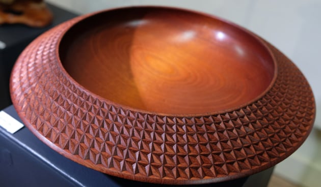 Zina Burloiu is Romanian and Terry Martin is Australian. They first met and worked together twenty years ago in Canada, and since then have collaborated on individual pieces, exhibitions and projects across Europe, North America, Asia and Australia. As always, their ideas and cultures resonated when they designed this piece together. 
The pattern Zina carved represents the joining of their two cultures, two lives of creative experience, and their friendship.