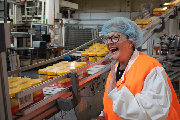 As Vegemite turns 100, one of the original Happy Little Vegemites from its first TV commercial, Trish Cavanagh, was given a tour of the Vegemite factory, which has been on the same site since the first jar rolled off the line.
