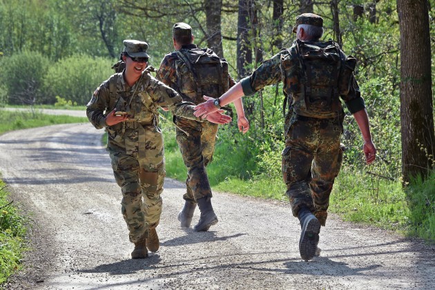 US Army Command Sgt Maj. Muriel A. Macdonald, left, claps hands with a German army reserve soldier.
Gertrud Zach via US Defense