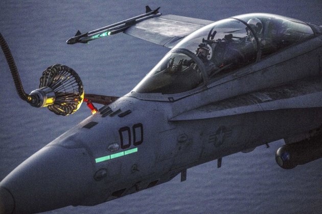 Marines refuel in the air over Iwakuni, Japan. The Marines are assigned to Marine Aerial Refueler Transport Squadron 152 and Marine All-Weather Fighter Attack Squadron 242. Marine Corps photo by Cpl. Nathan Wicks