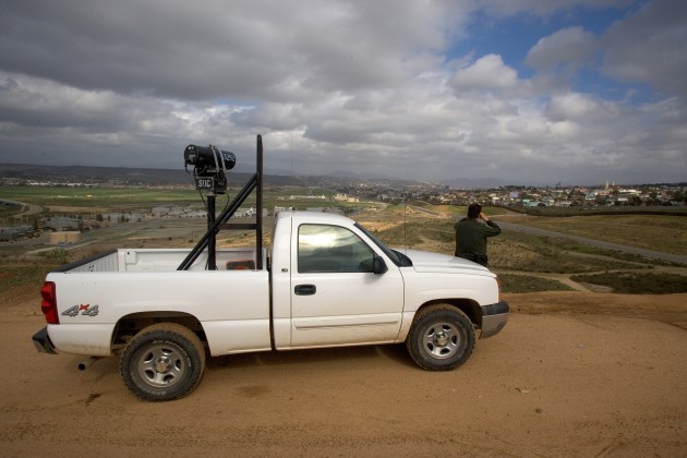 A US Border Patrol agent scans the Mexican border for signs of activity.
US CBP