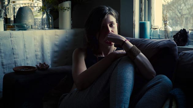 First Place - "Vice" by Evan George. 
Shot at the beginning of the Aussie summer in the living room of a really cool old-school and rundown four bedroom apartment that sits 20 seconds walk from Bondi beach. Having the light source come entirely from the setting sun through the slightly decrepit windows gave the image a surreal and desolate feeling on the subject, Emma, with long defining shadows helping to accentuate a feeling of angst as she&rsquo;s surrounded by elements of vice.