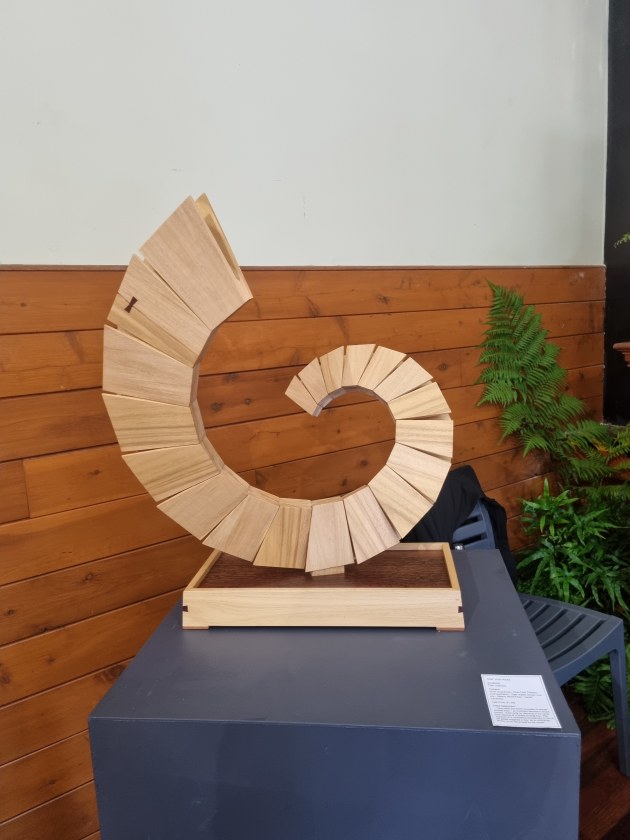 Victor Robba, Gateway, silver quandong, tiger myrtle veneer, plywood. &lsquo;A contrasting dovetail key in one of the petals suggests a &lsquo;key&rsquo; as an unlocking device.&rsquo;