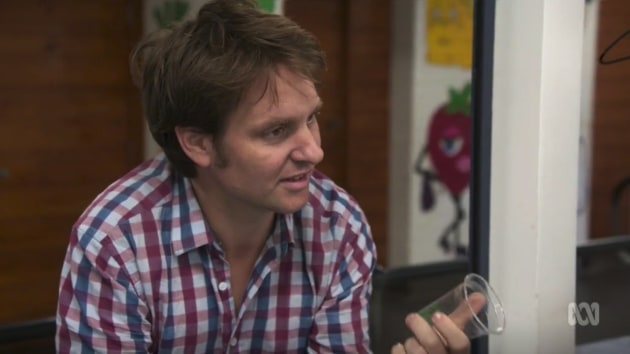 Craig Reucassel with a compostable plant-based bioplastic BioCup at Kiama High School canteen.  Image sourced from ABC War On Waste Season 2 episode 3.