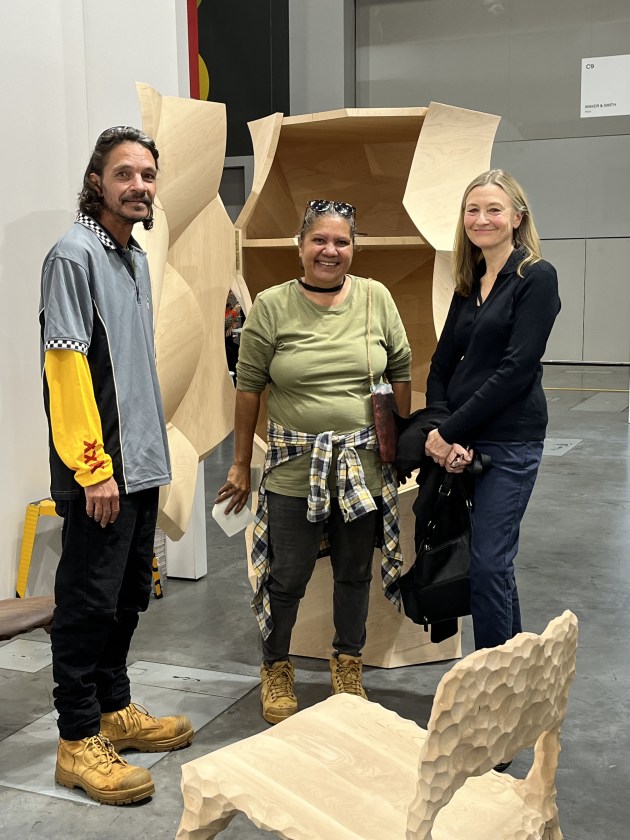 Kurunpa Kunpu artists Errol Evans and Tanya Singer with Linda Nathan. Standing before Manta Pilti Cabinet, $148,000. Photo: Raf Nathan