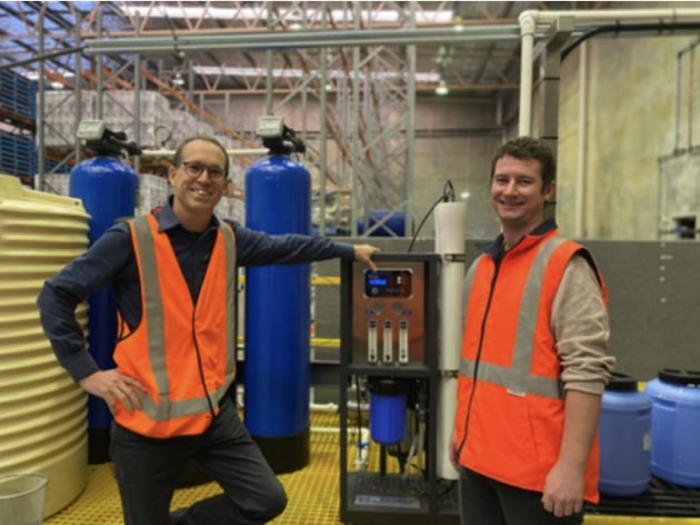 Managing Director, Ben Cole (left) and Brad Dack (Operations Manager) in front of equipment used to unlock lupins value as a food product. (Image source: Wide Open Agriculture)