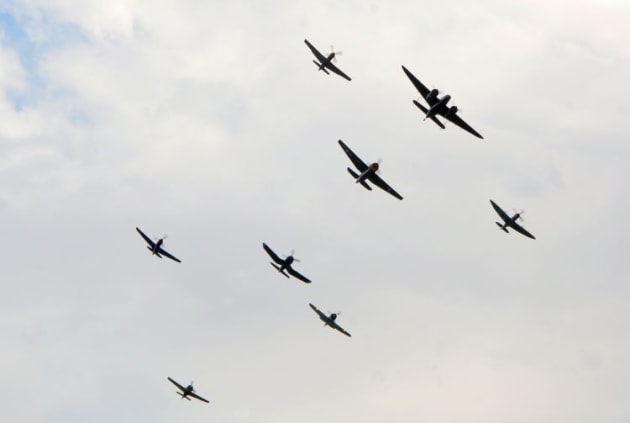 Can you pick the aircraft from the sihouettes? The warbird balbo passes in front of the crowd. (Steve Hitchen)