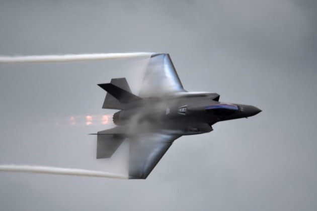 Moisture in the air created a lot of opportunity to get a good shot of condensation streaming off the F-35 Joint Strike Fighter. (Steve Hitchen)