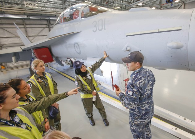Air Force Aviation Camp for Women participants have a close look at a No. 6 Squadron EA-18G Growler.
Defence