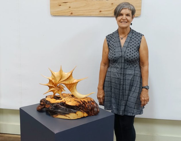 Wootha Prize coordinator Corrie Wright stands with the 2019 exhibition installation.