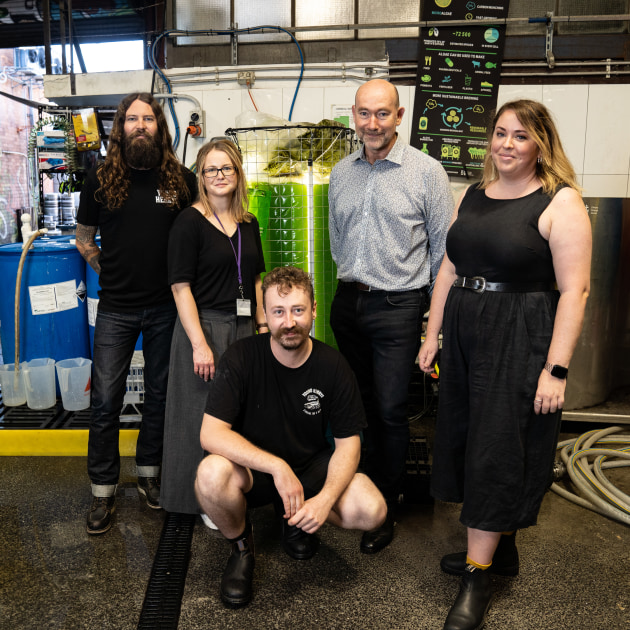 In 2020, Young Henrys (YH) started a carbon emission reduction project with UTS' Climate Change Cluster (C3), using algae to capture CO2. 
YH co-founder Oscar McMahon (left), head brewer Jesse Searles (Centre) and the team from C3.