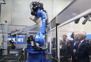 PM praises bottled vitamin automation in pre-election factory tour