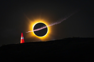 Photographer captures wingsuit flight across total solar eclipse