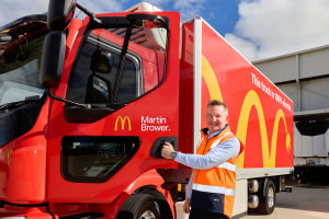 Electric truck drives through golden arches